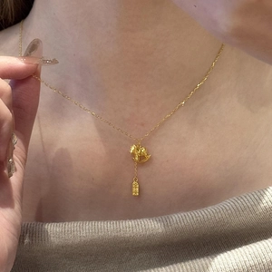 24K gold plated necklace with rocking horse and engraved pendant on elegant model
