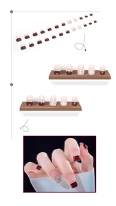 Detail of burgundy French press-on nails with pearl accents and silver glitter finish