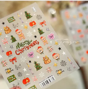Macro detail of TS-4197 Christmas nail art stickers with bears, trees and snowflakes