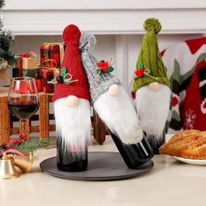 Three-piece knitted Christmas gnome wine bottle covers with faux fur beards for holiday decor