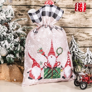 Gnome Christmas burlap gift bag with black and white plaid drawstring and Merry Christmas print