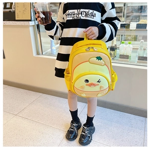 Close-up of cute yellow cartoon duck backpack with durable two-way metal zippers