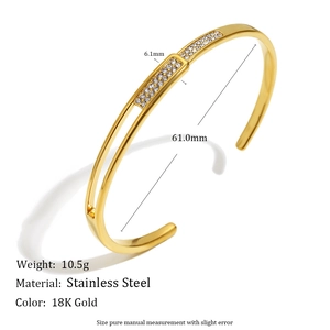 Detailed view of 18K gold plated stainless steel open bangle with zircon inlay details