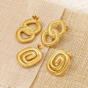 Golden stainless steel stud earrings with interlocking rings and textured spiral designs