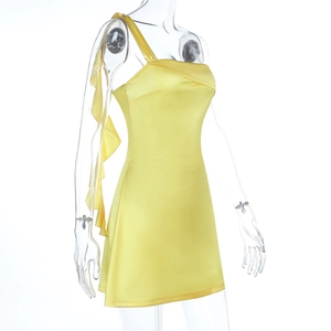 Detailed side view of yellow satin one-shoulder mini dress with ruffled neckline detail
