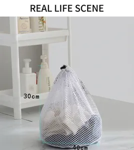 Close-up of fine mesh laundry bag with drawstring closure showing 30x40cm size details