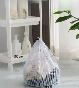 Close-up of fine mesh laundry bag with drawstring closure showing 30x40cm size details