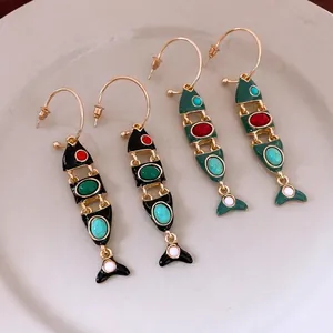 Vintage style enamel fish tassel earrings in black and dark green with golden hoops