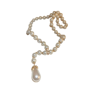 Elegant white round pearl necklace with a teardrop pearl pendant and gold metal accents