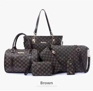 Detailed view of 6-piece brown leather handbag set with M-pattern print and gold hardware