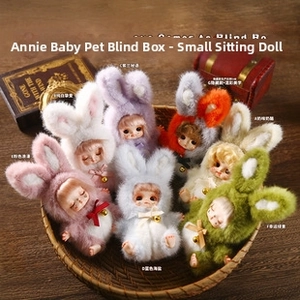 Close-up of colorful bunny plush dolls with bells in a gift basket with retro props