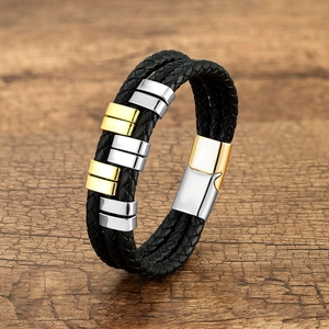 Men's multilayer black braided leather bracelet with gold and silver metal charms and magnetic clasp