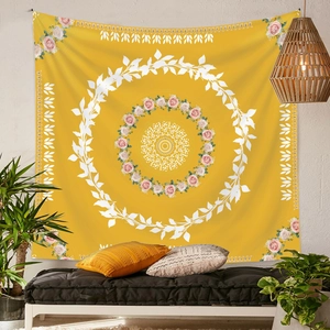 Detail of yellow mandala tapestry in a cozy living room with sofa and plants