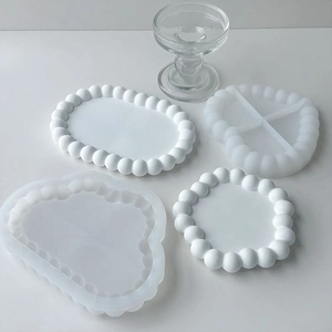 Set of 4 white silicone bubble coaster molds in heart, oval, and round shapes for DIY resin
