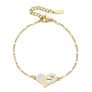 Detail of a stainless steel heart pendant with white enamel and golden bead chain