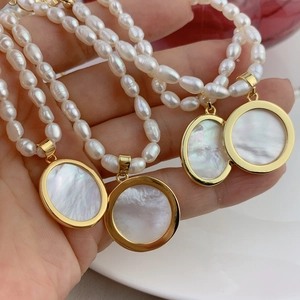 Natural freshwater pearl necklace with gold mother of pearl Virgin Mary pendants