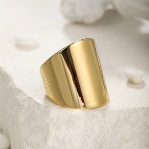 Macro shot of 14k gold plated wide band stainless steel ring with mirror finish texture