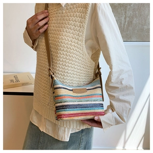 Colorful woven stripe crossbody bag with brown leather strap in casual style