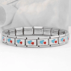 Macro shot of stainless steel Italian charm bracelet with red and blue heart enamel