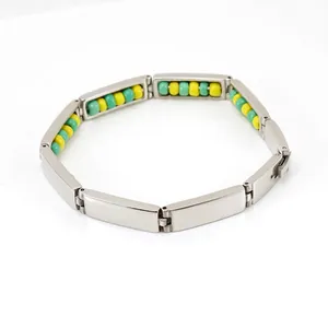 Stainless steel beaded energy bracelet with 18K gold accents and secure fold-over clasp