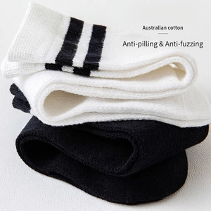 Knee-high mesh kids socks in white with black stripes and solid black cotton