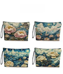 Detail showing four assorted floral and landscape art print patterns on cosmetics bags