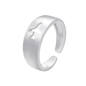 Adjustable silver ring with hollow airplane pattern cutout on polished metal surface