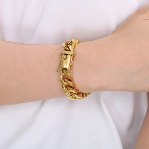 Detail of 13mm 18K gold plated Cuban link bracelet showing high-shine finish on wrist