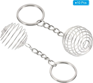 Close-up of flexible silver metal spiral pearl cages for jewelry and DIY pendant making