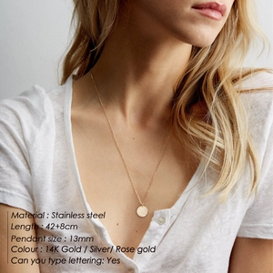 Double layer stainless steel necklace with 13mm round pendant worn by a model