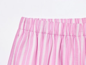 Close-up of pink and white striped fabric with elastic waistband and woven texture