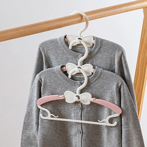 Expandable bow-knot baby clothes hangers with stacked hooks and non-slip telescopic shoulders