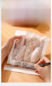 Reusable food storage bag with zipper and writable label area for organizing chicken wings