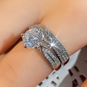 Luxury silver double-layer bridal ring set with sparkling round-cut moissanite stone