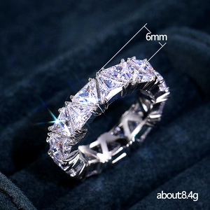 Eternity ring featuring triangular cut zirconias on a silver band, 6mm width stones