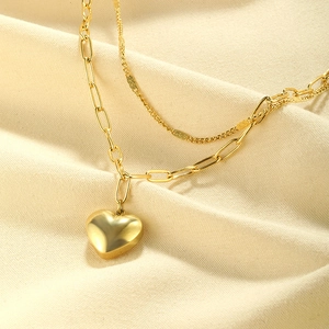Double-layered gold necklace with minimalist 3D heart pendant and paperclip chain