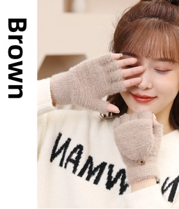 Close-up of brown fingerless faux cashmere gloves with decorative wrist button on model