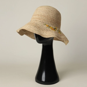 Beige raffia sun hat with yellow floral embroidery and wavy brim for women