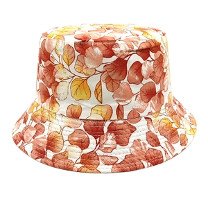 Detail view of cotton bucket hat featuring autumn leaf print and reinforced brim stitching