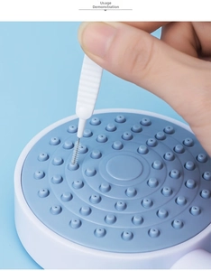 Detailed view of mini shower head cleaning brush clearing small nozzles efficiently