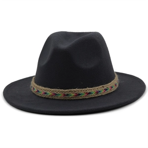 Close-up of black wool fedora featuring a colorful bohemian embroidered hat band