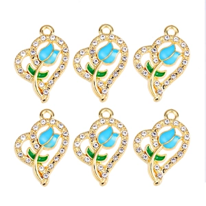 Detail showing six golden heart pendants with blue tulips and sparkling rhinestones