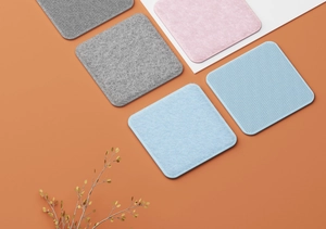 Close-up of square felt anti-slip pads in multiple colors for sofa and sheet fixing