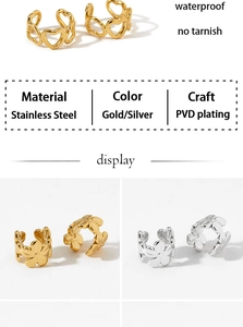 Detail of PVD gold plated stainless steel heart and flower ear cuffs showing waterproof texture