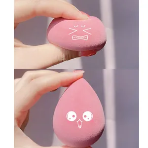 Macro shot of pink teardrop makeup sponge showing high elasticity and soft texture
