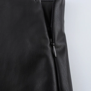 Chic black PU leather shorts with sleek A-line cut and hidden zipper detail