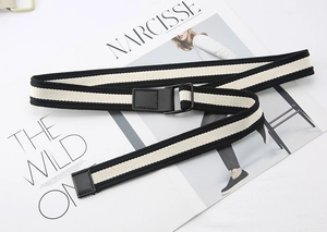 Detail view of black and white striped canvas belt with matte black square slide buckle
