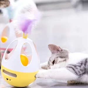 Interactive egg-shaped electric cat toy with purple feathers and bird sound simulation