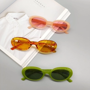 Vintage oval sunglasses set in pink, amber, and green colors with thick Y2K style frames