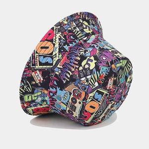 Close-up of graffiti bucket hat featuring retro cassette tape and urban street art patterns